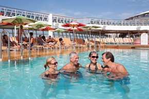 an adult and more youthful few swim together in a cruise ship share
